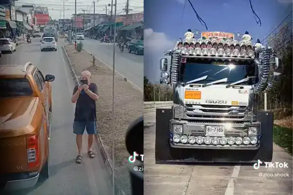 Иностранец фотографирует грузовик на шоссе